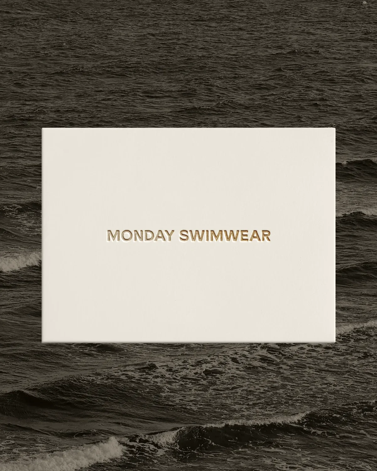 Sealed Monday Swimwear envelope — click to open the interactive e-card pop-up